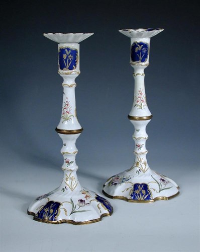 Lot 749 - A pair of late 18th/early 19th century Bilston enamel candlesticks