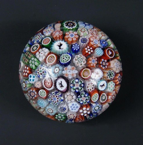 Lot 499 - A miniature Baccarat close-packed millefiori paperweight, circa 1850