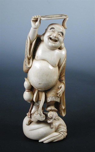 Lot 761 - An early 20th century Japanese ivory figure of Hotei