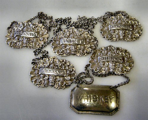 Lot 399 - A matched set of five George IV/William IV silver bottle tickets