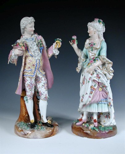 Lot 109 - A pair of late 19th century German figures offering flowers