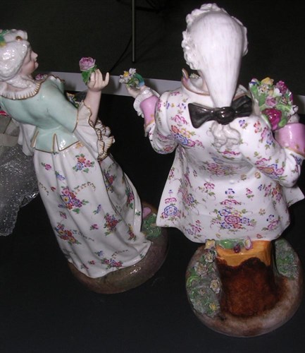 Lot 109 - A pair of late 19th century German figures offering flowers