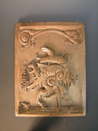 Lot 522 - An Arts & Crafts carved oak panel