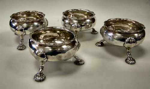 Lot 431 - A set of four George IV silver salts