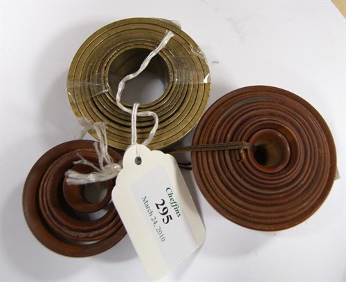 Lot 295 - A treenware nest of eleven horological watch glass rings, 16-54mm
