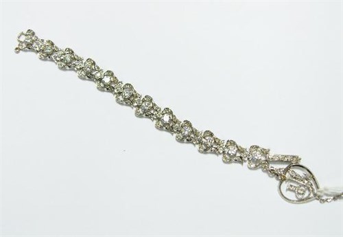Lot 264 - A platinum and diamond articulated bracelet