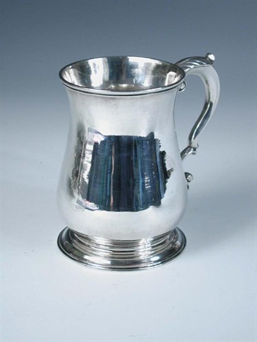 Lot 404 - A George II silver beer mug