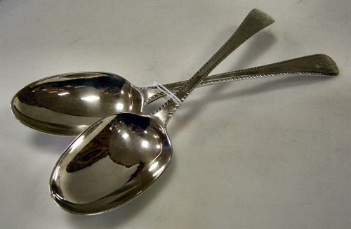 Lot 459 - A Pair of George III Old English feather edged tablespoons