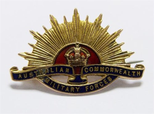Lot 228 - A 9ct yellow gold military brooch