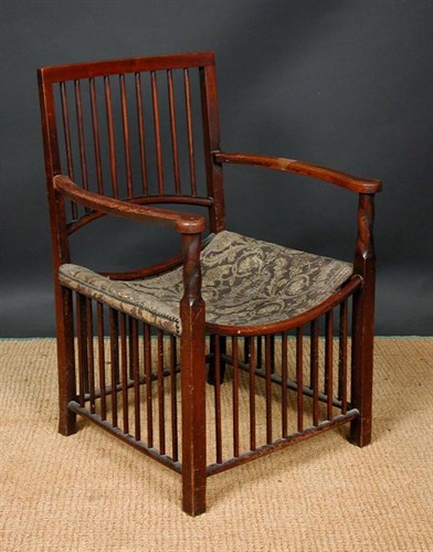 Lot 533 - A Liberty & Co. Arts & Crafts elbow chair