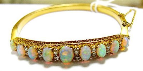 Lot 241 - An opal and diamond hinge bangle