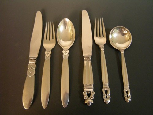 Lot 524 - A Danish metalwares Cactus pattern knife, fork and spoon by Georg Jensen