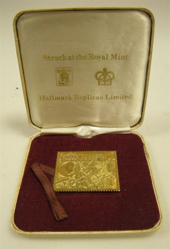 Lot 323 - A 22ct gold replica of the 1929  £1 Postal Union Stamp