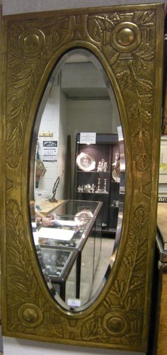 Lot 525 - An Arts & Crafts brass framed mirror