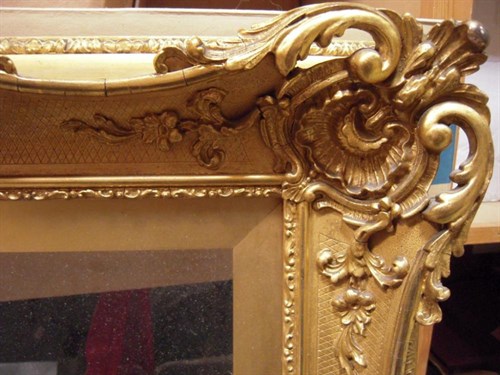 Lot 740 - A 19th Century English gilded swept frame with...