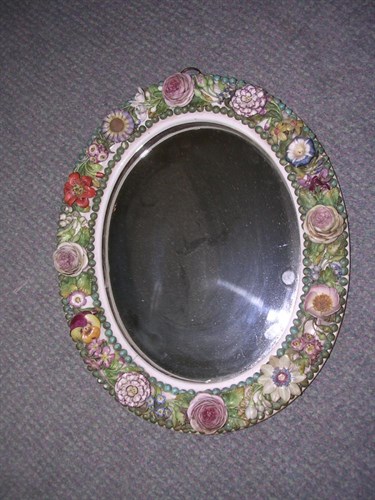 Lot 89 - Attributed to John Bevington, a mid Victorian Coalport floral encrusted oval mirror