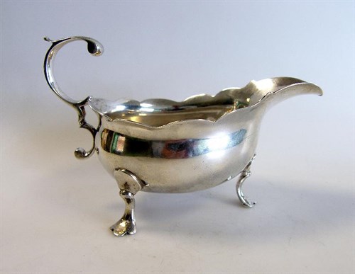 Lot 463 - A George II silver sauce boat
