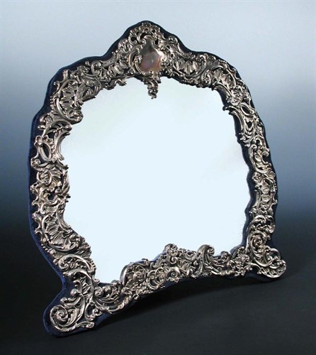 Lot 377 - A silver mounted dressing table mirror