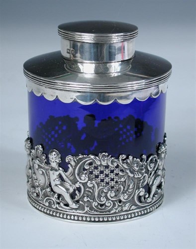 Lot 394 - A late Victorian silver mounted blue glass teacaddy