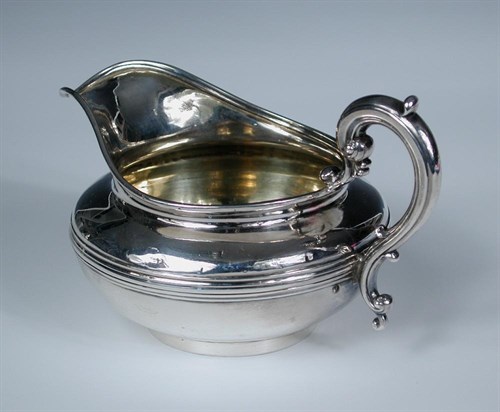 Lot 412 - A William IV silver creamer