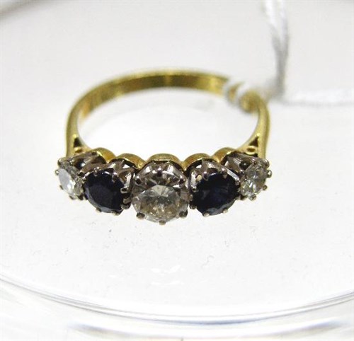 Lot 231 - A five stone sapphire and diamond ring