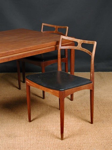 Lot 537 - Johannes Anderson for Christian Linneberg, A Danish teak extending dining table and seven chairs