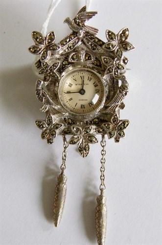 Lot 303 - A silver and marcasite cased cuckoo clock type brooch watch