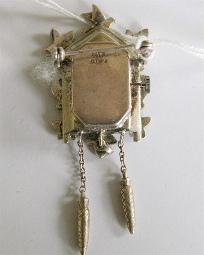 Lot 303 - A silver and marcasite cased cuckoo clock type brooch watch