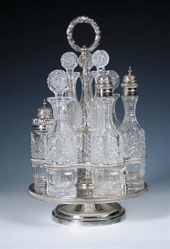 Lot 342 - A Victorian electroplate nine bottle cruet frame