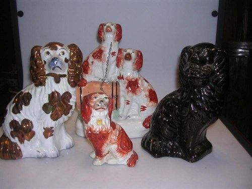 Lot 25 - Four 19th century Staffordshire spaniel groups