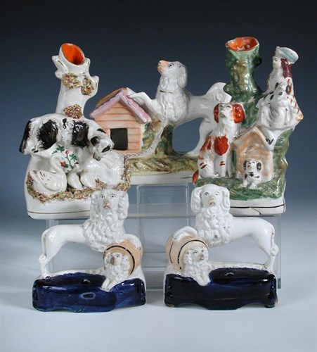 Lot 29 - Five Staffordshire groups featuring dogs