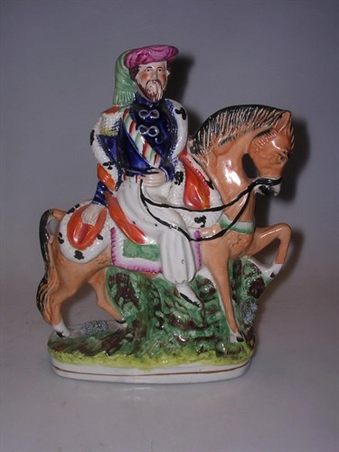 Lot 36 - A mid 19th century Staffordshire equestrian figure of Omar Pasha