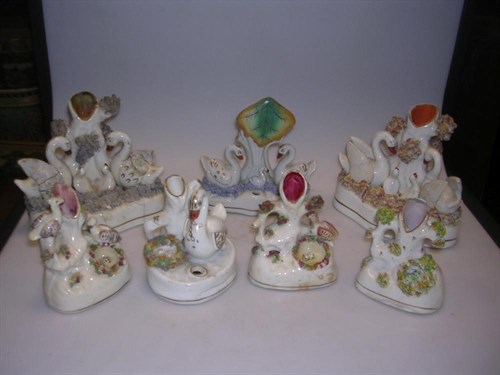 Lot 41 - Seven Staffordshire groups featuring swans