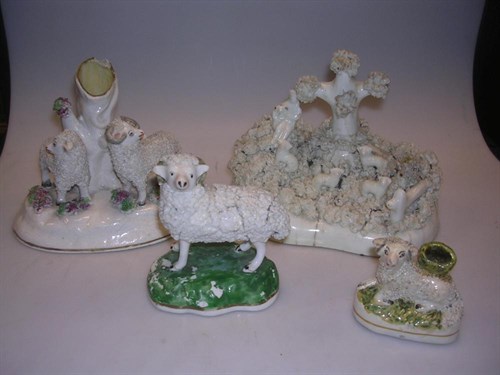 Lot 43 - Four Staffordshire groups featuring sheep