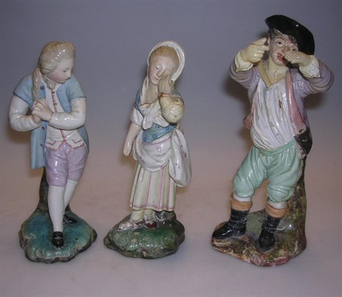 Lot 124 - A pair and another Hochst Damm pottery figure