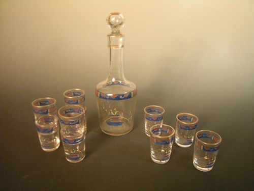 Lot 491 - A French enamelled glass liquer set by Damon et Delente, Malesherbes, Paris