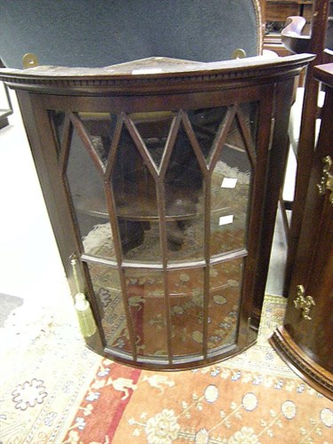 Lot 42 - A small glazed corner cupboard