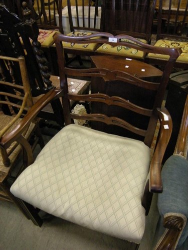 Lot 24 - A mahogany elbow chair
