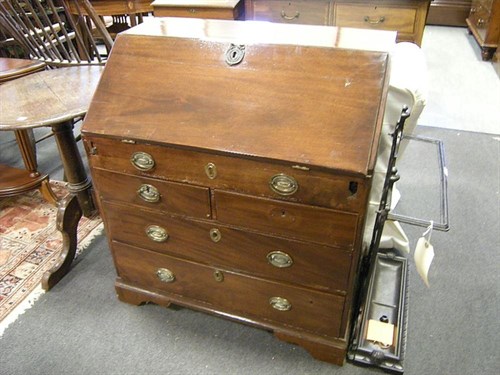 Lot 50 - A small mahogany bureau