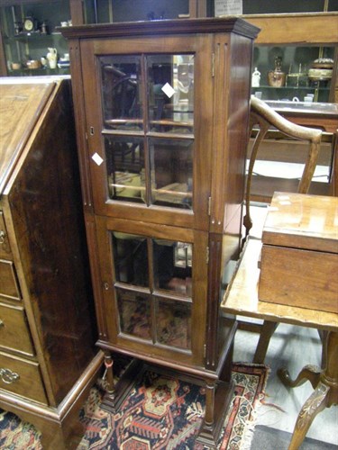 Lot 37 - A mahogany glazed 2 part narrow cabinet