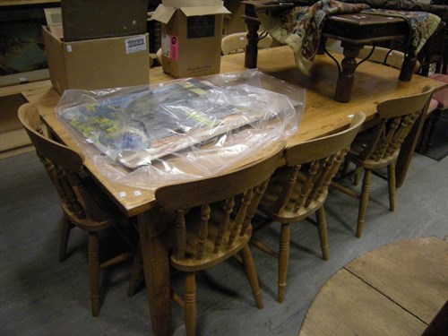 Lot 99 - A modern pine kitchen table and set of 8...