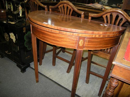 Lot 34 - A Sheraton style occasional table