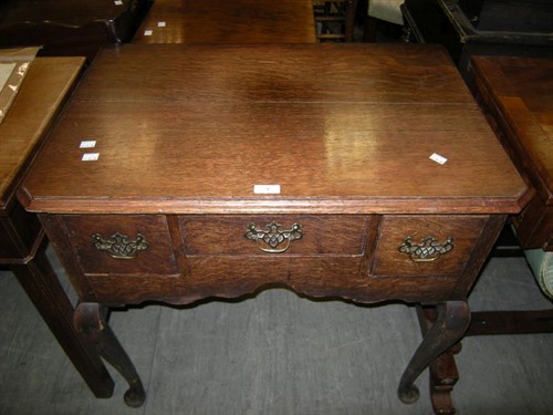 Lot 3 - An early 19th century oak lowboy