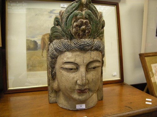 Lot 28 - A Vietnamese carved polychrome head