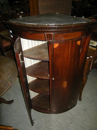 Lot 9 - A George III corner cupboard with shell inlaid...