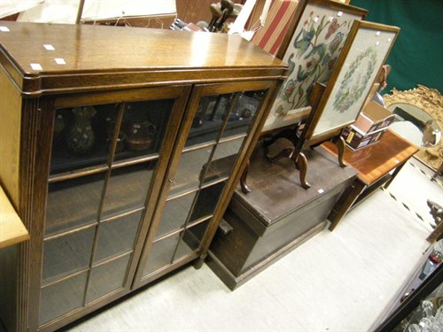 Lot 139 - An Edwardian glazed bookcase, two needlework...