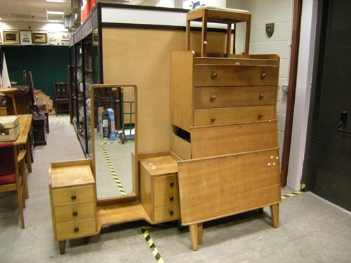 Lot 141 - A Gordon Russell oak wardrobe, single bed,...