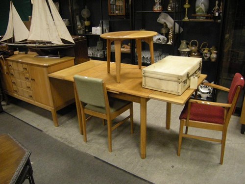 Lot 137 - A Gordon Russell dining table, two chairs and...