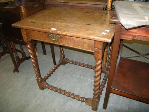 Lot 20 - An oak side table with drawer