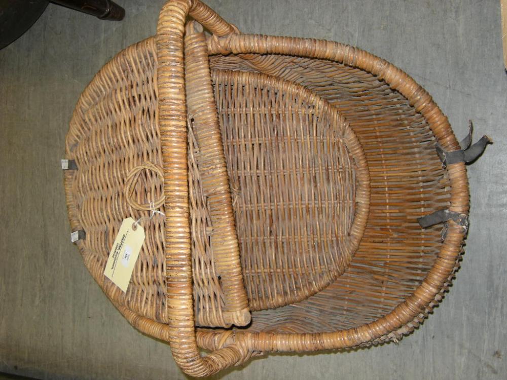 Lot 506 - A large wicker hamper basket of panier design